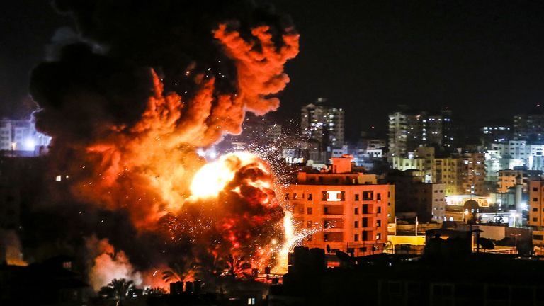 Fire and smoke billow above buildings in Gaza City during reported Israeli strikes on March 25, 2019. - Israel's military launched strikes on Hamas targets in the Gaza Strip today, the army and witnesses said, hours after a rocket from the Palestinian enclave hit a house and wounded seven Israelis