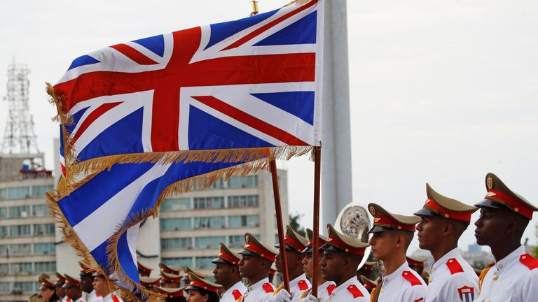The Union Flag and Cuba&#39;s national flag flutter above a guard of honour as Britain&#39;s Prince Charles and Camilla, Duchess of Cornwall, arrive in Havana, Cuba, March 24, 2019