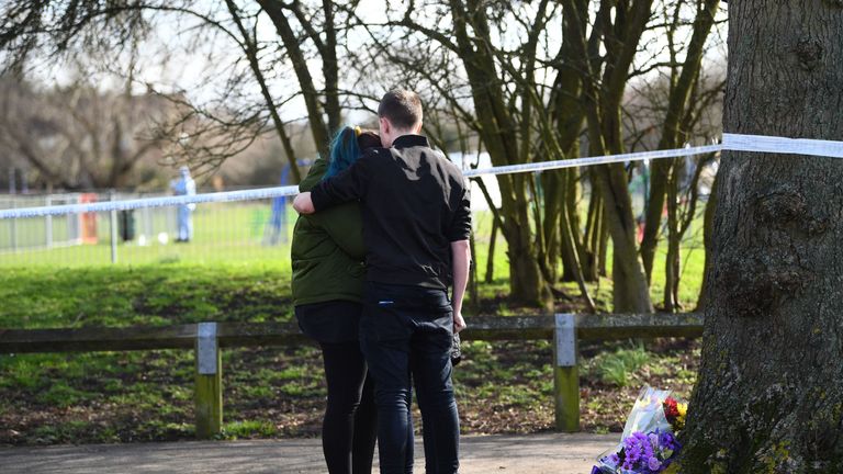 People place flowers near the scene of the stabbing

