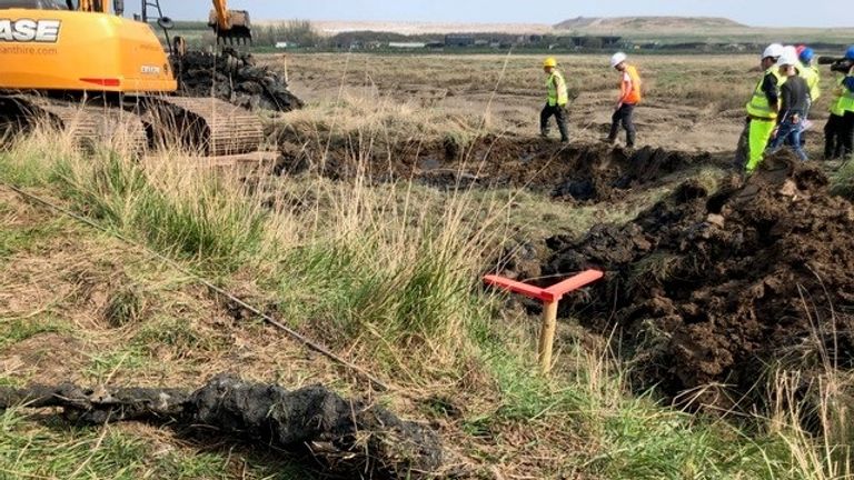 A browning machine gun from a Hurricane plane is seen as the plane is dug up in Essex
