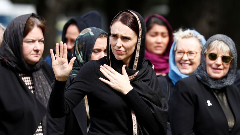 Jacinda Ardern waves as she leaves the vigil and prayers