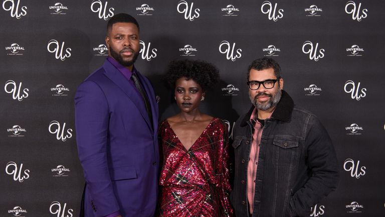 Us star Winston Duke, left, Nyong'o,  and director Jordan Peele