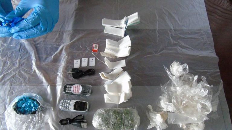 Ministry of Justice pic of drugs, mobile phones, chargers and SIM cards that were found inside dead rats