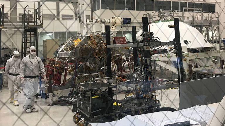 Technicians working Mars 2020&#39;s System&#39;s Test 1 approach their workstation in the Spacecraft Assembly Facility at NASA&#39;s Jet Propulsion Laboratory in Pasadena, California. Credits: NASA/JPL-Caltech