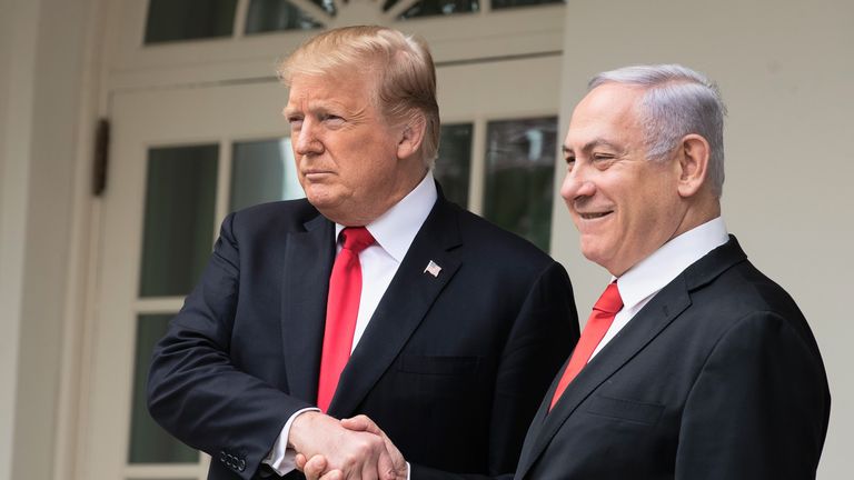 U.S. President Donald Trump and Prime Minister of Israel Benjamin Netanyahu shake hands while walking through the colonnade prior to an Oval Office meeting at the White House March 25, 2019 in Washington, DC