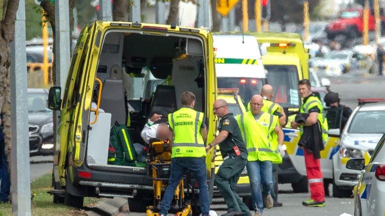 An injured person is loaded into an ambulance following a shooting at the Al Noor mosque in Christchurch