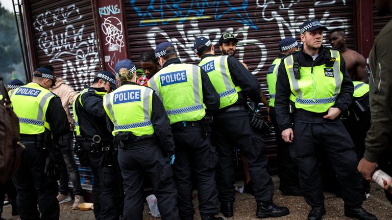 Police officers stop and search people on the final day of the Notting Hill Carnival on August 27, 2018 in London, England