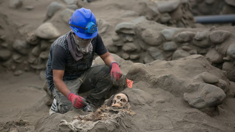 Archaeologists unearth a mass grave of children and adults from the Chimu culture at Pampa La Cruz in Huanchaco district of Trujillo, Peru, June 2018