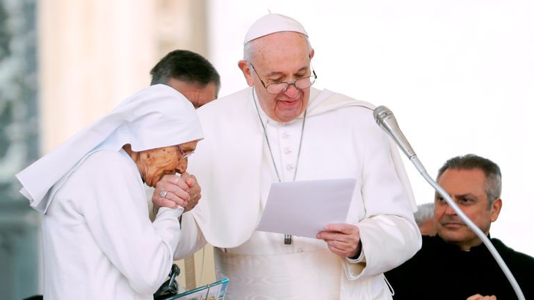 Pope Francis greets sister Maria Concetta Esu, an obstetrician who was working on the mission in Africa 