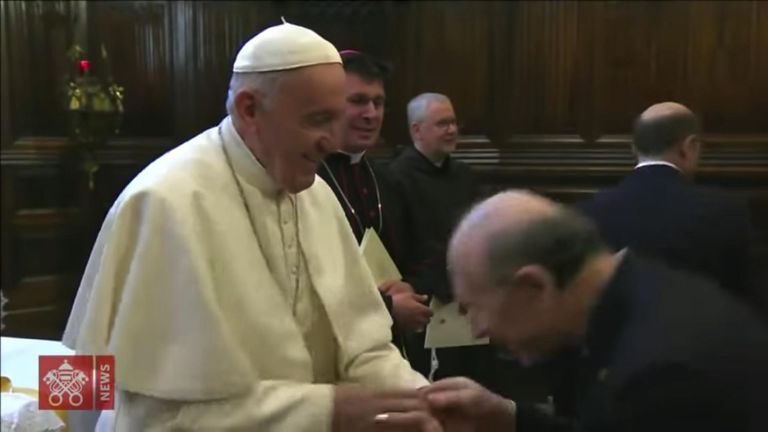 Pope Francis refuses to have his ring kissed. (Vatican TV)