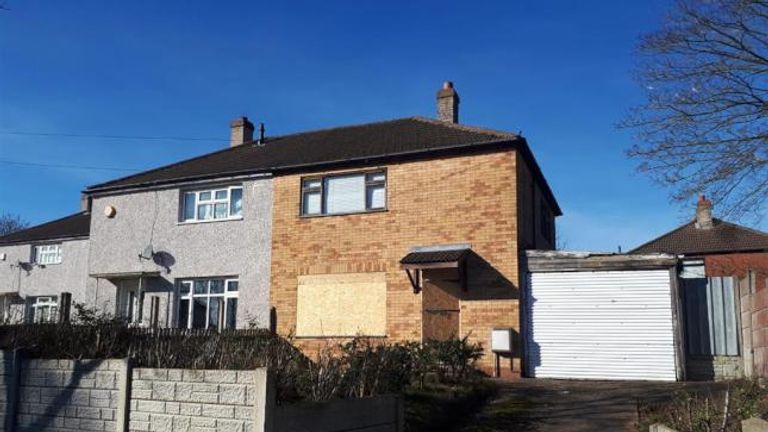 The house in Quinton has one of its ground floor windows boarded up. Bagshaws Residential