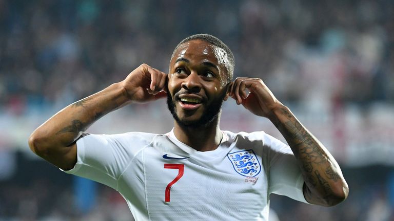 England&#39;s Raheem Sterling held his ears out as Montenegro fans shouted alleged racist abuse, after he slotted in the fifth goal.