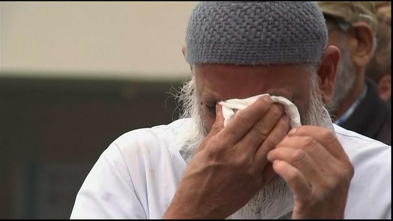 A mourner breaks down as Christchurch remembers those killed in the massacres