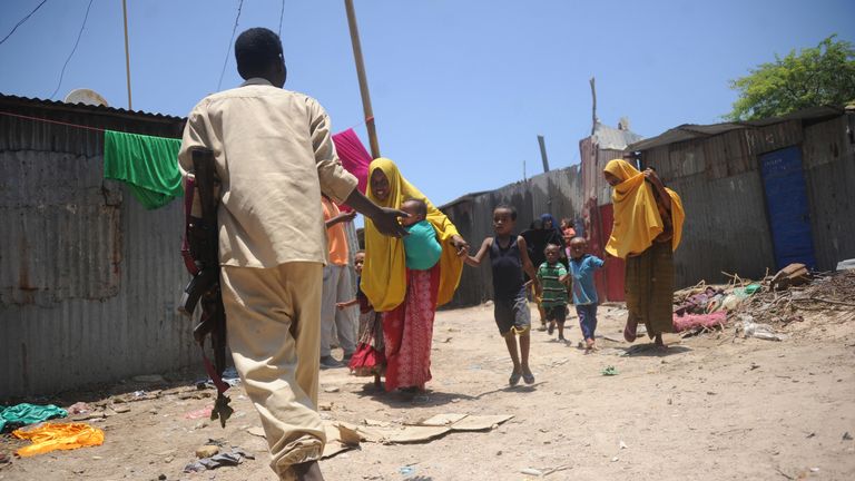 Somali women and children flee the scene after two explosions