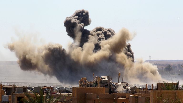 18 March: Smoke rises from the last besieged neighborhood in the village of Baghouz, Deir Al Zor province