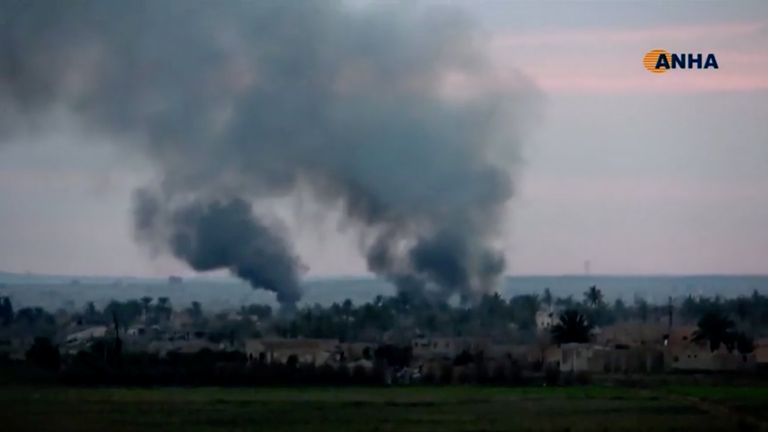 Smoke rises from a village near Baghouz, Syria as the SDF fight Islamic State militants