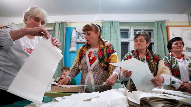 Members of a local electoral commission count votes at a polling station following a presidential election in Rohatyn in Ivano-Frankivsk Region, Ukraine March 31, 2019
