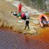 Suitcase containing woman's body fished from toxic lake