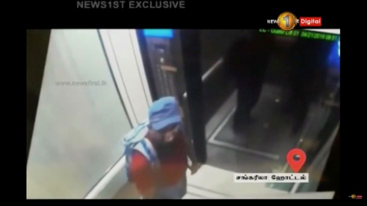 A man with a backpack is seen in Shangri La hotel elevator in Colombo