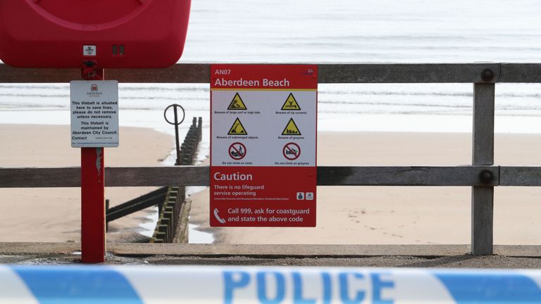 Warning signs inside a police cordon on Aberdeen beach where two people were pulled from the sea by the RNLI and taken to hospital where they died. Emergency services were called to the scene in Aberdeen in the early hours of Friday following a report that two females were in the water. PRESS ASSOCIATION Photo. Picture date: Friday April 19, 2019. See PA story RESCUE Beach. Photo credit should read: Jane Barlow/PA Wire 