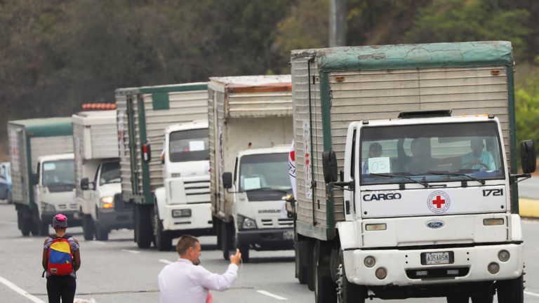Red Cross aid trucks move towards the capital of Caracas