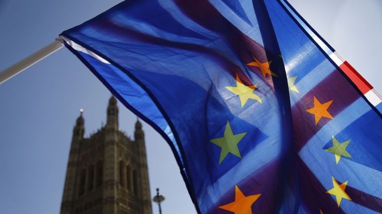 An activist waves a combination of the Union and the EU flags near the Houses of Parliament in central London on April 10, 2019. - The EU's chief Brexit negotiator said Tuesday that the length of any delay to the divorce that the bloc may grant Britain will depend on what plan Prime Minister Theresa May brings to a crunch summit. (Photo by Tolga AKMEN / AFP) (Photo credit should read TOLGA AKMEN/AFP/Getty Images) 