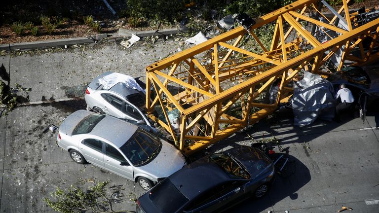 Two of those killed were in cars crushed by the crane