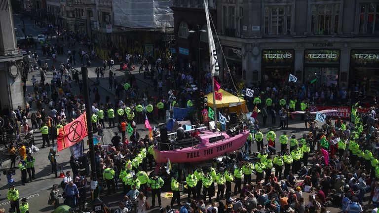 Climate change activists are seen during a protest of the Extinction Rebellion at Oxford Circus in London, Great Britain, April 19, 2019