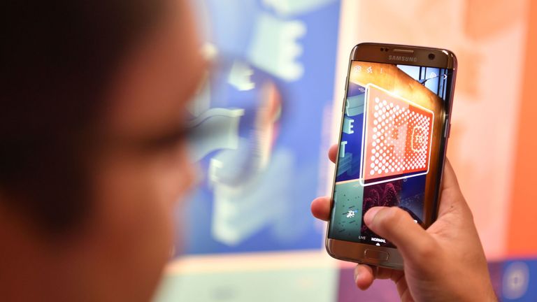 A man tries out Facebook&#39;s augmented reality camera software during the annual F8 summit at the San Jose McEnery Convention Center in San Jose, California on May 01, 2018. - Facebook chief Mark Zuckerberg announced the world&#39;s largest social network will soon include a new dating feature -- while vowing to make privacy protection its top priority in the wake of the Cambridge Analytica scandal. (Photo by JOSH EDELSON / AFP) (Photo credit should read JOSH EDELSON/AFP/Getty Images)
