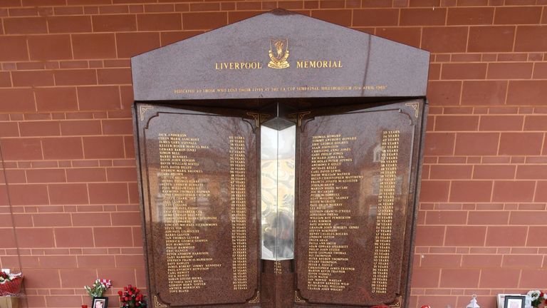 Floral tributes and balloons are pictured in front of the Hillsborough memorial, outside of Liverpool Football Club's main stand at Anfield in Liverpool, north-west England, on April 15, 2019 to commemorate the 30th anniversary of the Hillsborough football stadium disaster in which 96 Liverpool football fans were killed.