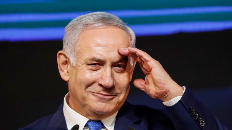 Israeli Prime Minister Benjamin Netanyahu gestures as he addresses supporters at his Likud Party headquarters