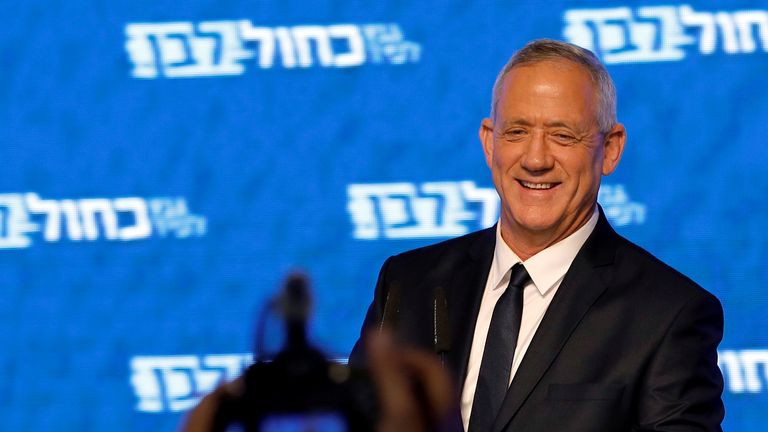 Benny Gantz, head of Blue and White party, smiles as he delivers a speech following the announcement of exit polls in Israel's parliamentary election
