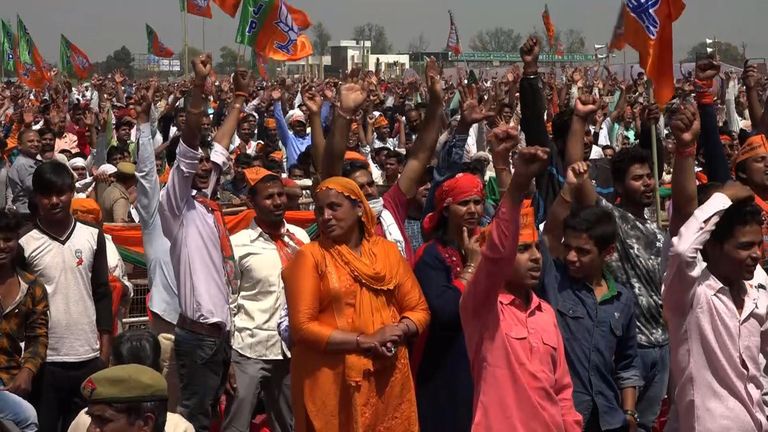 Supporters of Narendra Modi listen to one of his election rallies