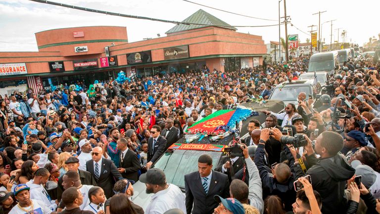 Nipsey Hussle&#39;s procession drove past his clothing store, where he was killed.