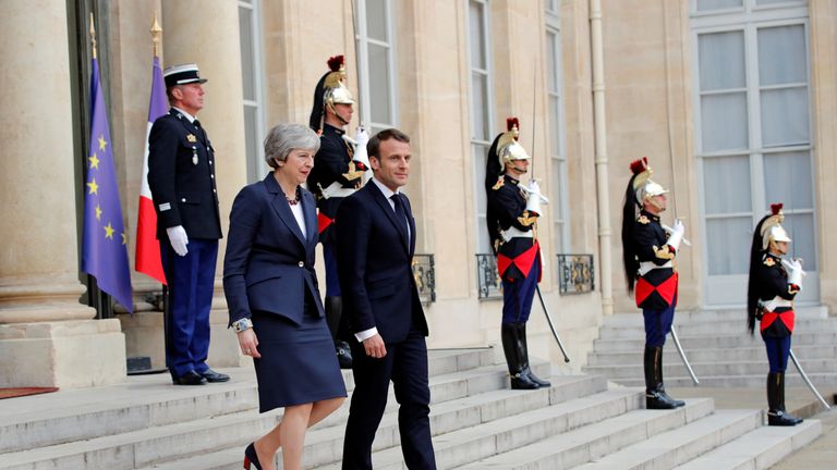 Theresa May leaves her meeting with Emmanuel Macron in Paris