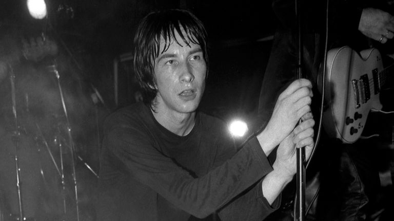 Mandatory Credit: Photo by Peter J Walsh/Pymca/REX/Shutterstock (3487932a).Bobby Gillespie of Primal Scream on stage at the Hacienda, Manchester 1991