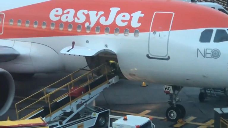 A baggage handler working on an EasyJet flight at Manchester Airport was spotted getting a bit of exercise on the job.