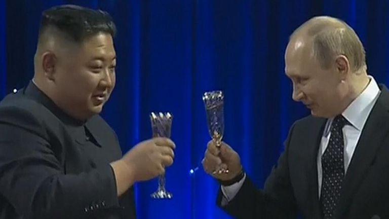 Mr Putin and Mr Kim showed their friendship by raising a glass to each other