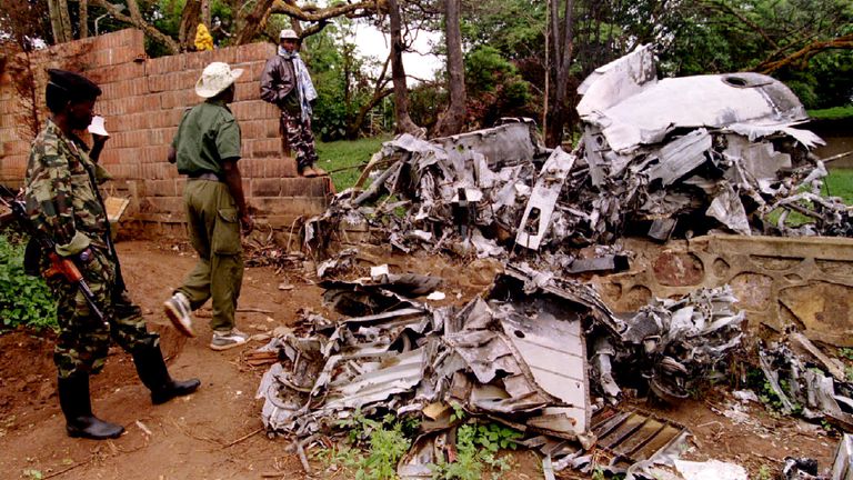 Rwanda Patriotic Front (RPF) rebels inspect the wreckage of the president&#39;s plane, in May 1994
