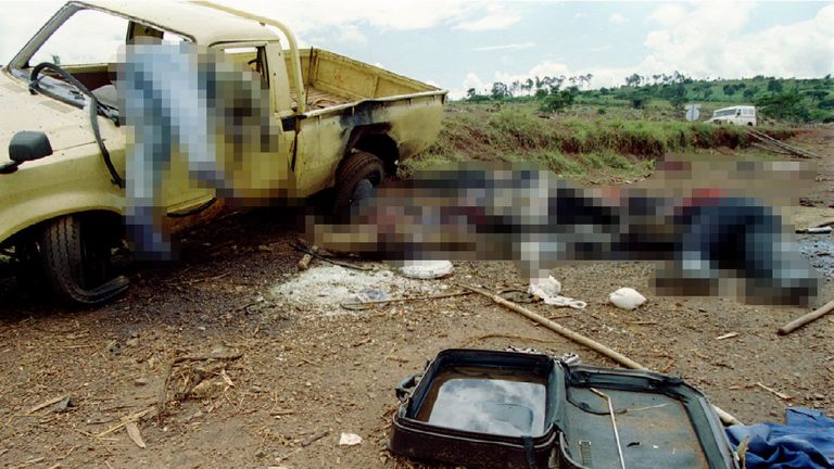 Dead Rwandans lie along the side of the road 8 May 1994