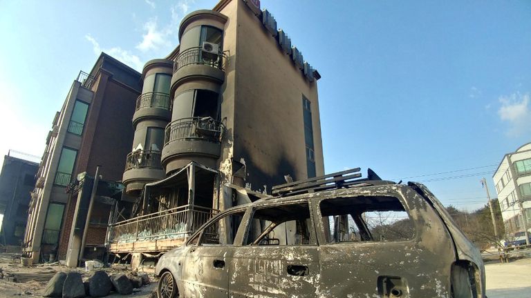 Buildings and vehicle damaged during a wildfire in Goseong, South Korea