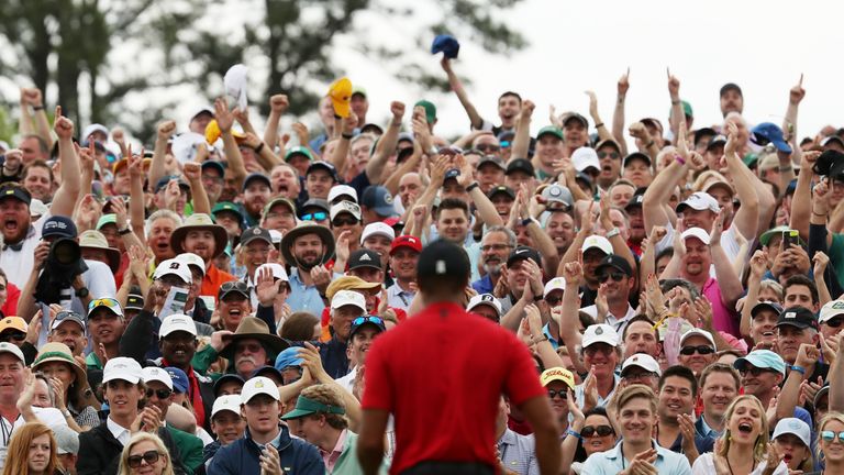 Crowds flocked to watch Woods sink his final putt