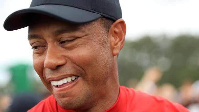 AUGUSTA, GEORGIA - APRIL 14: Tiger Woods of the United States reacts as he walks off the 18th hole after winning the Masters at Augusta National Golf Club on April 14, 2019 in Augusta, Georgia. (Photo by Andrew Redington/Getty Images) 