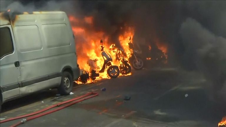 Tear gas and motorcycles on fire at &#39;yellow vests&#39; protest in Paris
