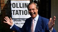 Brexit Party leader Nigel Farage gestures as he arrives at a polling station 