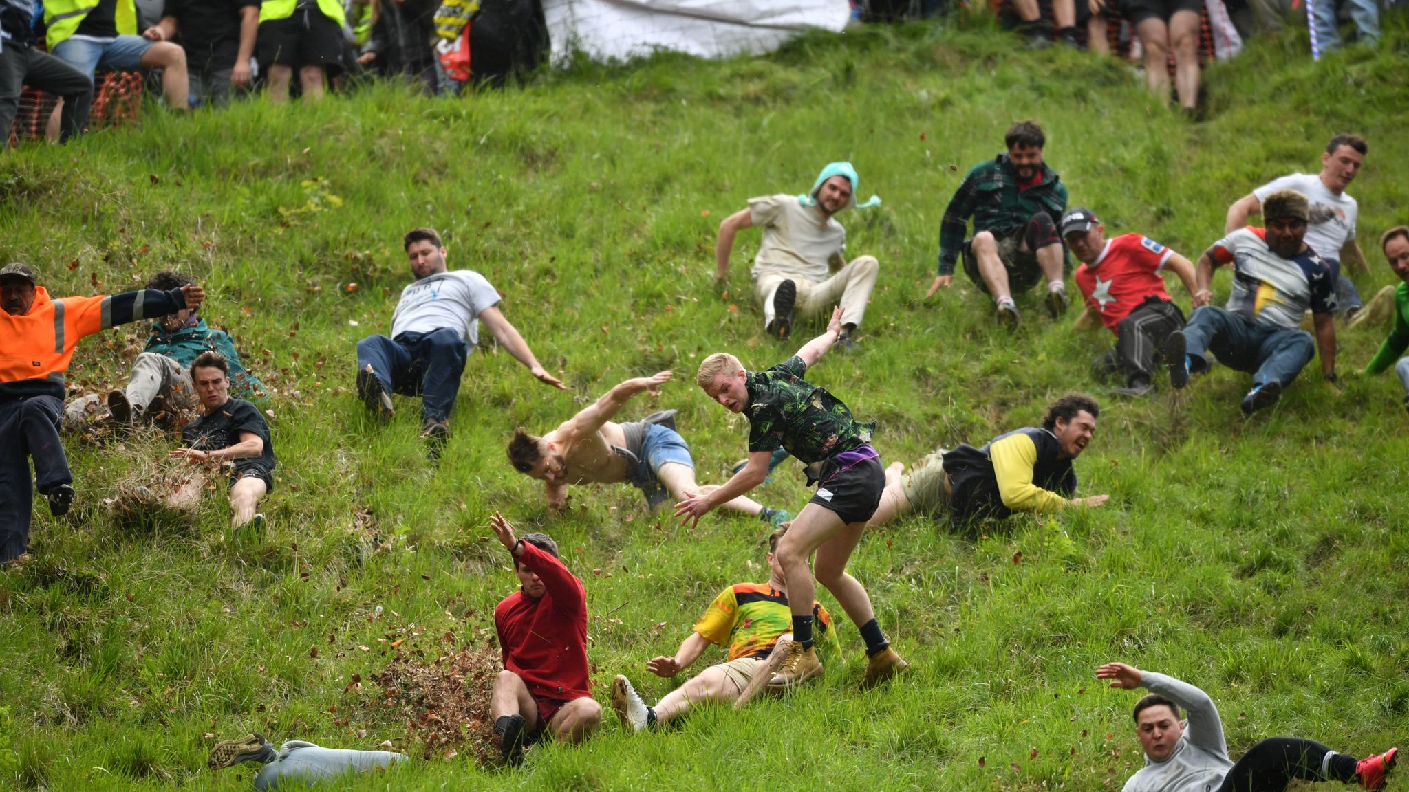 Take part in competition. Cooper's Hill Cheese Rolling. Cheese Rolling. Take Part in a Competition. Where does the Cheese Rolling take place.