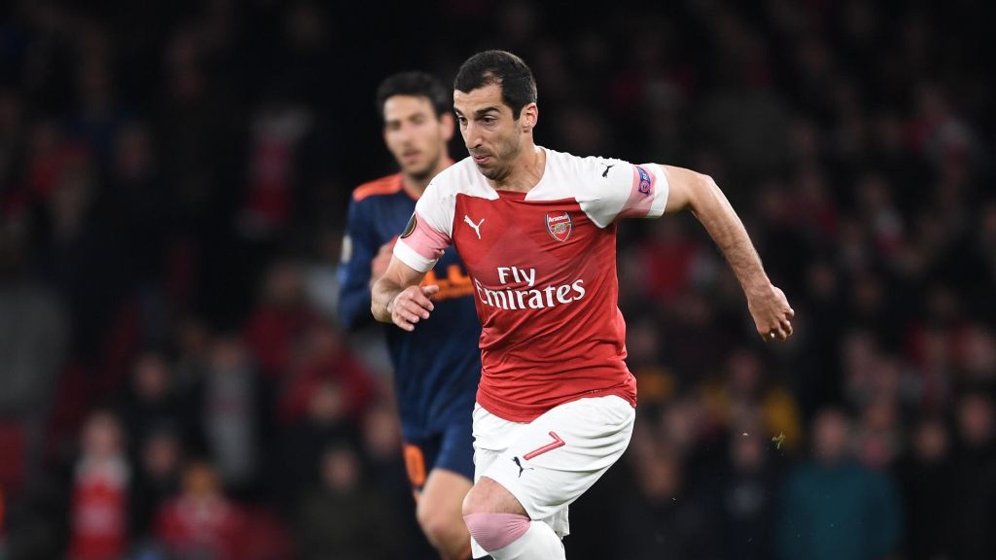 Why is Henrikh Mkhitaryan wearing number 77 at Arsenal in Europa League but  7 in the Premier League?