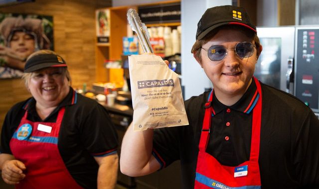 Lewis Capaldi takes a break from festival to serve up sausage rolls in Greggs Lewis Capaldi takes a break from festival to serve up sausage rolls in Greggs