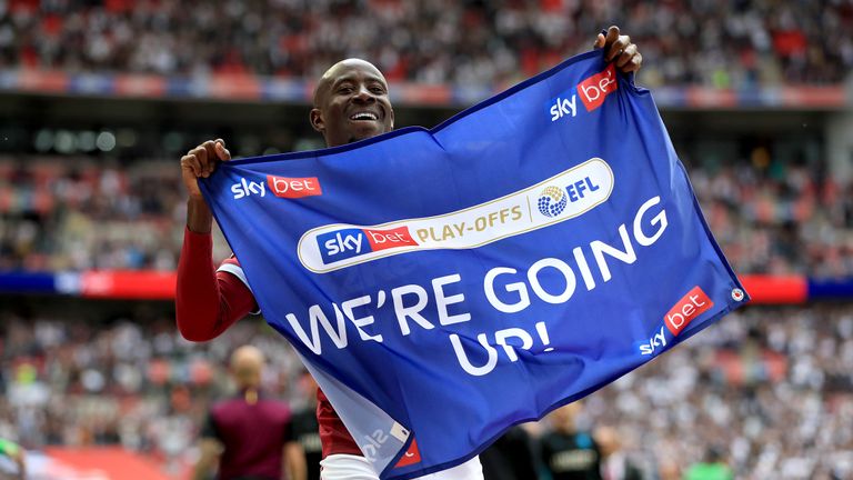 Aston Villa's Albert Adomah celebrates promotion after winning the Sky Bet Championship Play-off final at Wembley Stadium, London.