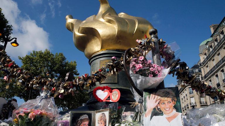 PARIS, FRANCE - AUGUST 31:  Iconic photos, flowers and messages dedicated to pay homage to Lady Diana to the 20th anniversary of her death adorn the plinth of the Flame of Liberty statue on August 31, 2017 in Paris, France. Princess Diana died in a car crash on August 31, 1997 near the Pont de l'Alma tunnel. The Flame of Liberty statue became the unofficial memorial to Diana, Princess of Wales.  (Photo by Thierry Chesnot/Getty Images)
